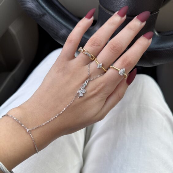 Snake charm hand chain (green eye)